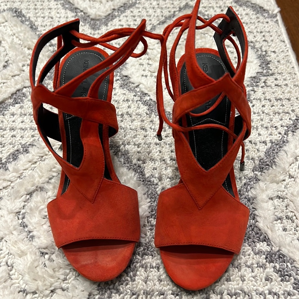 Sued red pump. Lace up back